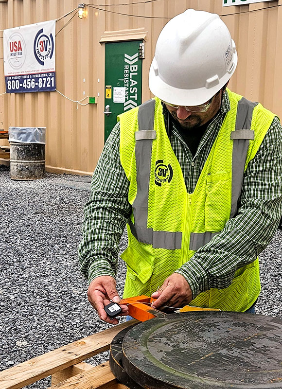 Technician attaching an RF tag to inventory